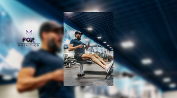 Athlete using a cable machine to do seated cable pulls. 